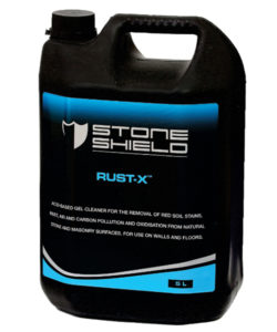 A-black-5-liter-plastic-container-of-Stoneshield-Rust-X-a-gel-cleaner-designed-for-the-removal-of-red-soil-stains -rust-and-cement-pollution-The-label-features-a-blue-and-black-design-with-white-and-blue-text-and-includes-the-Stoneshield-logo-at-the-top