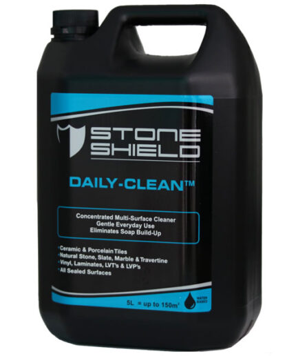 A-5-liter-black-plastic-container-of-Stoneshield-Daily-Clean-a-concentrated-multi-surface-cleaner-The-label-is-black-with-blue-and-white-text-featuring-a-shield-logo-and-stating-it-is-suitable-for-ceramic-and-porcelain-tiles-natural-stone-vinyl-laminates-and-all-sealed-surfaces-It-promotes-gentle-everyday-use-and-eliminates-soap-build-up-The-bottom-of-the-label-notes-that-it-is-water-based-and-covers-up-to-150m²