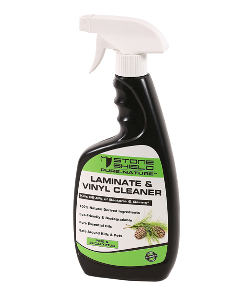 The-image-features-Stoneshield-Pure-Nature-Laminate-and-Vinyl-Cleaner-in-a-black-spray-bottle-with-a-white-trigger-nozzle-The-label-has-a-green-and-white-design-displaying-the-Stoneshield-logo-at-the-top-The-product-is-promoted-as-killing-99-point-9-percent-of-bacteria-and-germs-and-is-made-from-100-percent-natural-derived-ingredients-Additional-features-include-being-eco-friendly-biodegradable-and-containing-pure-essential-oils-The-cleaner-is-also-labeled-as-safe-around-kids-and-pets-The-scent-is-specified-as-eucalyptus-and-pine-with-an-illustration-of-pine-cones-on-the-label