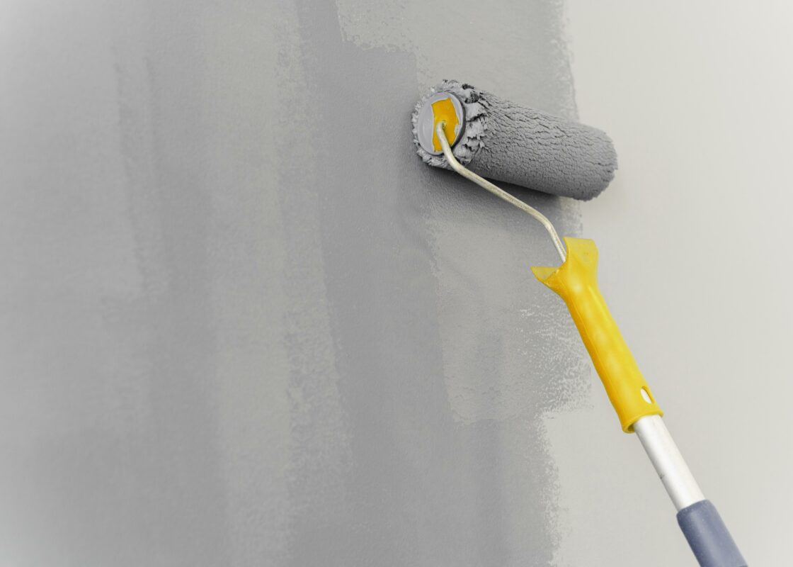 Applying cement wall sealer with roller - enhancing wall protection through expert painting